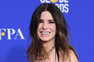 Sandra Bullock Enjoys Birthday Week Outing With Son Louis as She Continues to Put Family First 26 026 08 03 085545 Sandra Bullock enjoys a birthday week outing with her son Louis in New York City.